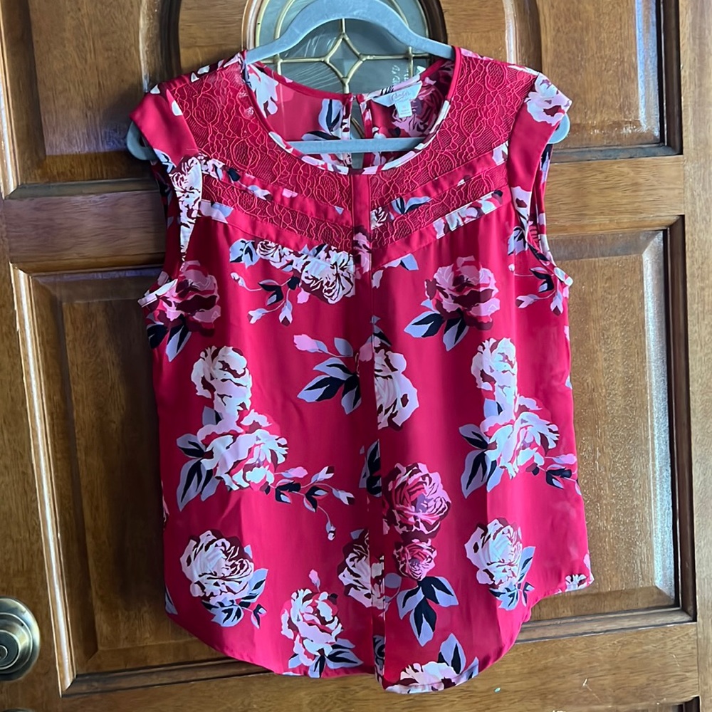 Candie’s red blouse